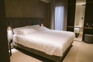 Postel nebo postele na pokoji v ubytování Villa Grumolara & Spa