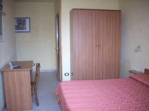 Il Bivio Hotel tesisinde bir odada yatak veya yataklar