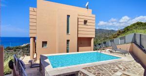 Бассейн в Ouzo Panoramic Houses 1, with private pool или поблизости