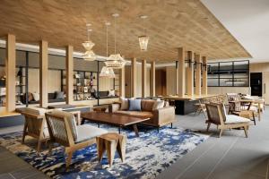 a lobby with a couch and chairs and a table at Fairfield by Marriott Tochigi Utsunomiya in Utsunomiya