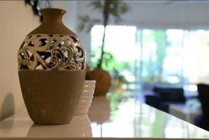 a vase sitting on top of a table at BLUE OCEAN RIVIERA MAYA in Playa del Carmen