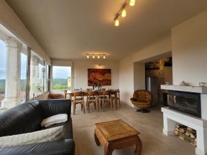 a living room with a couch and a table at Casa Acqua Dolce - House with 4 Bedrooms and Own Spa in Oprtalj