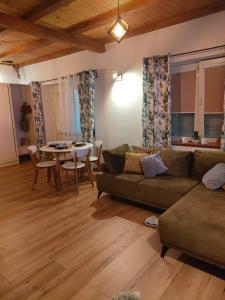 a living room with a couch and a table at Apartament w Centrum in Żuromin