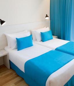 A bed or beds in a room at ALEGRIA Maripins Még 25 kép