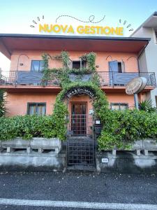 a building with a gate in front of it at B&B La Casa di Zia Lina in Monsummano Terme