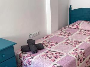 A bed or beds in a room at Casa Vacacional Isla