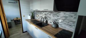 Kuchyň nebo kuchyňský kout v ubytování Apartmán 604