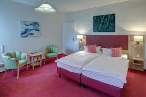 Postel nebo postele na pokoji v ubytování Hotel Leander