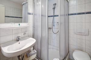 Koupelna v ubytování Hotel Leander