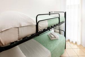 Posteľ alebo postele v izbe v ubytovaní Hotel Poseidon e Nettuno
