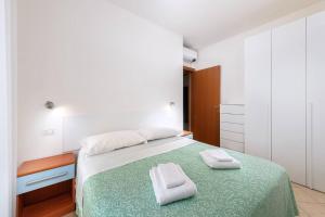 Posteľ alebo postele v izbe v ubytovaní Hotel Poseidon e Nettuno