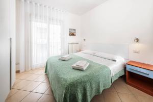 Posteľ alebo postele v izbe v ubytovaní Hotel Poseidon e Nettuno