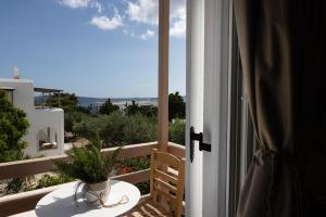 a view of a balcony with a plant on a table at Acoya Residences in Aliki