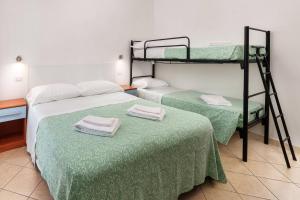 Posteľ alebo postele v izbe v ubytovaní Hotel Poseidon e Nettuno
