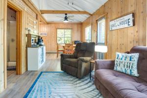 a living room with a couch and chairs and a kitchen at Lakefront Marenisco Cabin with Private Dock! in Bergland
