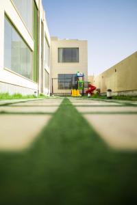 a view of a playground in front of a building at شاليه رويال الخبر - Royal Resort AL Khobar in Al Khobar
