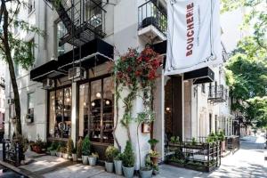 a store on a street with plants in front of it at Peaceful Japanese Ryokan in the heart West Village in New York