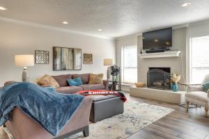 a living room with a couch and a fireplace at Norman Vacation Rental Less Than 1 Mi to University! in Norman