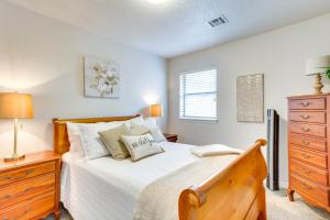 a bedroom with a large bed and a dresser at Norman Vacation Rental Less Than 1 Mi to University! in Norman