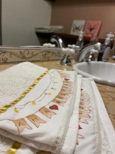 a towel sitting on a counter next to a sink at Ama respira y vive in Salta