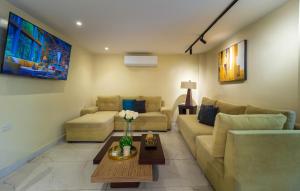 a living room with a couch and a table at Hotel Sada in Guayaquil
