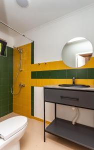 a bathroom with a sink and a toilet at Gergeti Trio in Kazbegi