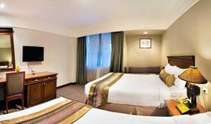 Кровать или кровати в номере Royal Rattanakosin Hotel SHA Plus
