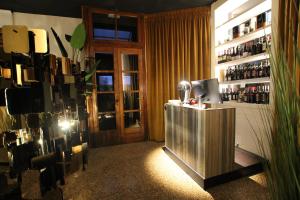 a room with a bar with a window and a door at Le Maginot Relais in Castelvetro Piacentino