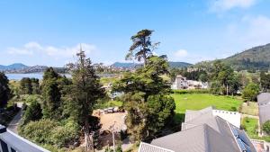 a view from the roof of a house with trees and a field at Nelma's Cosy in Nuwara Eliya
