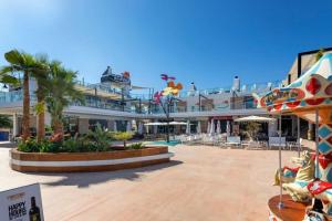 a resort with a pool and a resort at Torrebeach in Torre de la Horadada