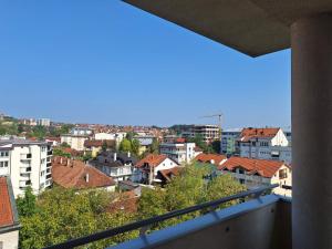 a view of a city from a balcony at PENTHAUS apartment in Banja Luka
