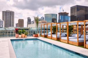a rooftop pool with a view of the city at AC Hotel by Marriott San Diego Downtown Gaslamp Quarter in San Diego