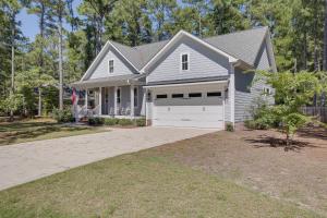 a house with a white garage and a driveway at North Carolina Home about 2 Mi to Pinehurst Resort in Pinehurst