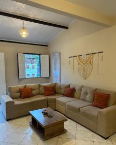 a living room with a couch and a coffee table at Pôr do Sol Suítes in Lençóis