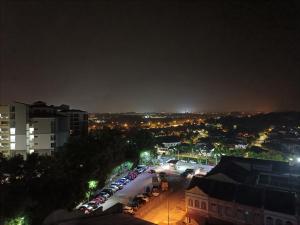 a city at night with cars parked in a parking lot at Anastays Studio & Apartment Suite with Free 2 & 4 Waterpark Tickets at Bayou Lagoon Resort in Ayer Keroh
