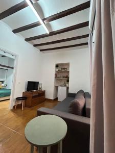 a living room with a couch and a table at Private apartment in the Old Town "Center&Beach" in Benidorm
