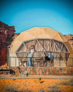 a painting of two people in a yurt at Moon Island Camp in Wadi Rum