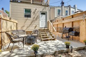 a patio with chairs and a grill in front of a house at Wilmington Home about 28 Mi to Downtown Philadelphia! in Wilmington