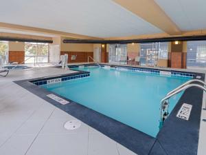 a large indoor swimming pool with blue water at Homewood Suites by Hilton Columbia, SC in Columbia