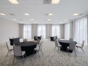 a large room with tables and chairs and windows at Homewood Suites by Hilton Columbia, SC in Columbia