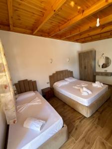 Ένα ή περισσότερα κρεβάτια σε δωμάτιο στο Hotel Vila Andi