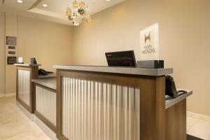 a lobby with a reception counter with a cash register at Homewood Suites by Hilton Midland in Midland