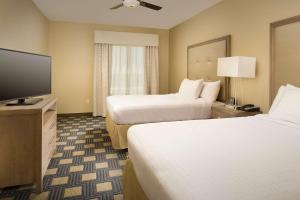 Postel nebo postele na pokoji v ubytování Homewood Suites by Hilton Midland