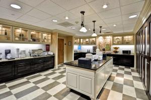 a large kitchen with a checkered floor at Hampton Inn & Suites Memphis East in Memphis