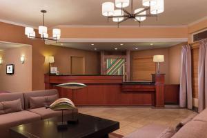 a living room with a waiting area with a couch at DoubleTree by Hilton Portland Tigard in Tigard