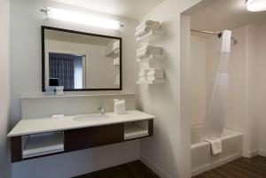 a bathroom with a sink and a mirror at Hampton Inn & Suites Charlotte/Pineville in Charlotte +25 photos