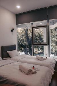Postel nebo postele na pokoji v ubytování Apple cozy hotel