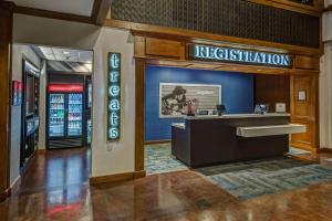 a hotel lobby with a reception desk and a restaurant at Hampton Inn & Suites Austin-Downtown/Convention Center in Austin