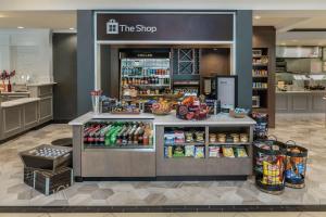 a store with a counter with food and drinks at Hilton Garden Inn Blacksburg University in Blacksburg