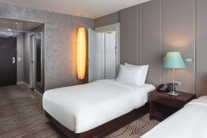 Postel nebo postele na pokoji v ubytování Hilton Berlin
